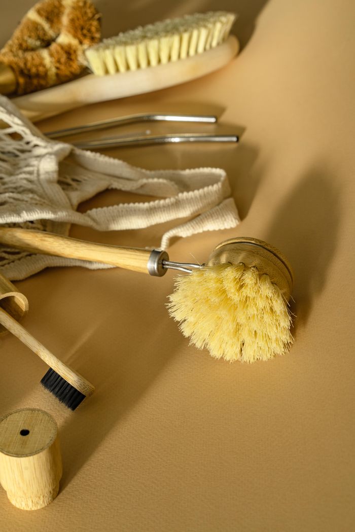 why-choose-us Minimalist still life of eco-friendly brushes on a beige background.